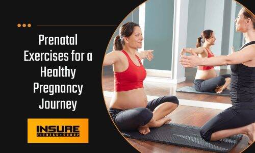 Instructor guiding a woman through seated prenatal stretches in a fitness studio.