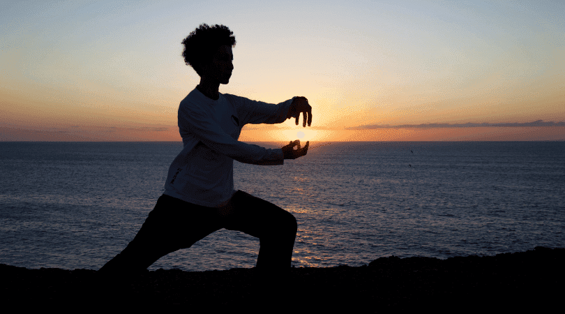 tai chi instructor on the beach